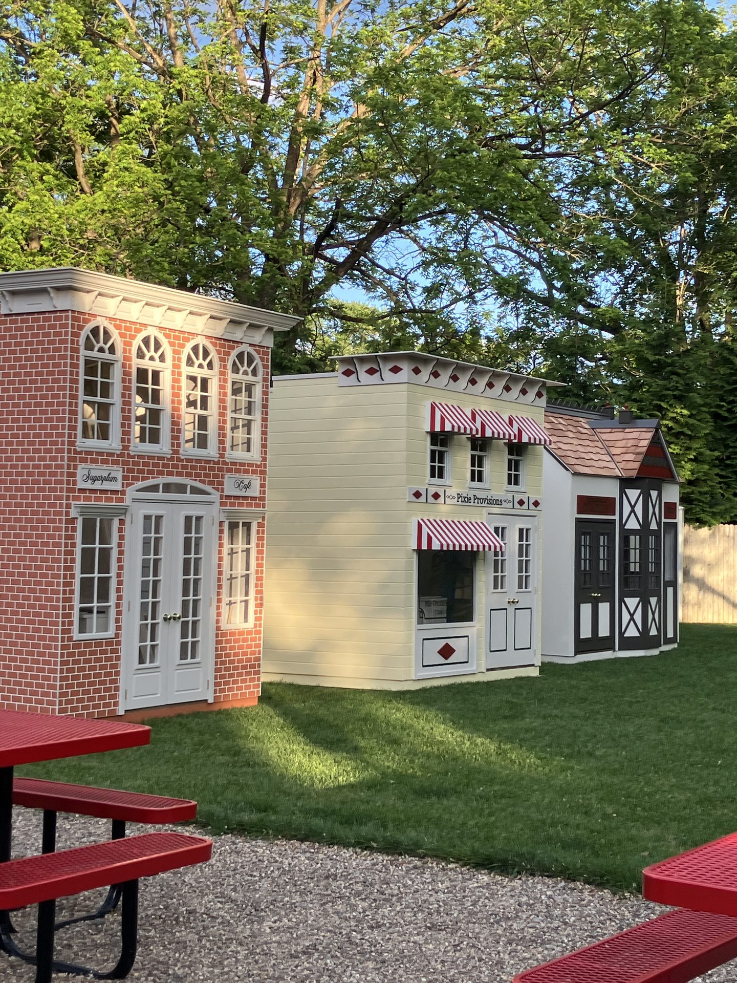 A wide view of the outdoor mini-village of playhouses.